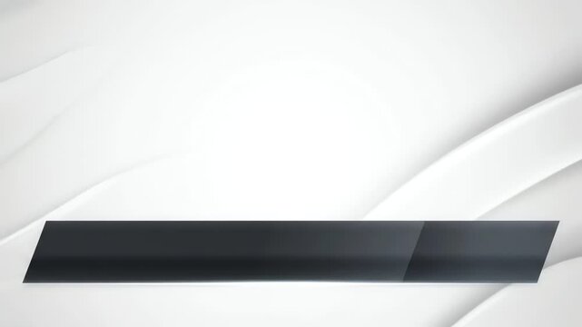A sleek black rectangular object on a white background with curved gray lines in the upper section.