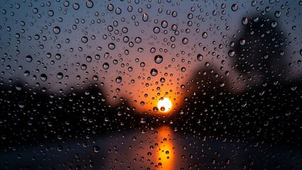Rainy evening with sunset through window.