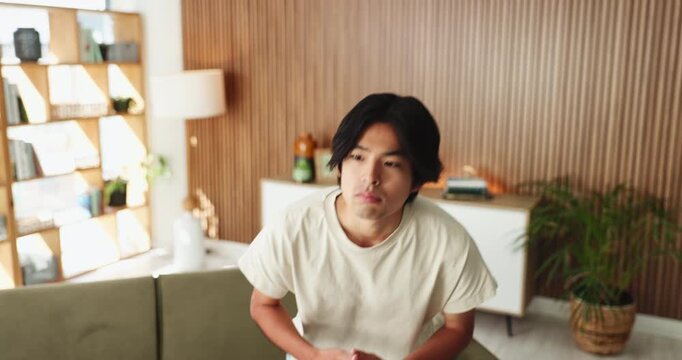 Stress, anxiety and man in therapy office for mental health support, nervous and counselling appointment. Psychology, walk or asian person with worry on couch, overthinking and waiting for evaluation