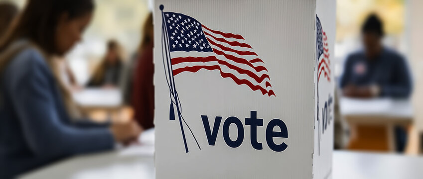 people casting their votes in the ballot box at a polling station