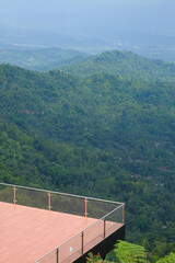 Mountain villa balcony with green valley view. Tropical rainforest trees. For graphic design, 3D rendering and banners