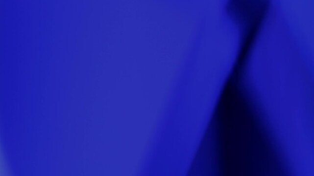 Abstract blue color background with light effects. . Abstract forms with faint highlights slowly rotating in elegant, low-key motion against deep void background. Seamless Loop. 
