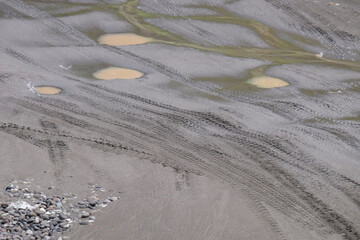 Car tire tracks on river sand. For graphic design, 3D rendering and banners