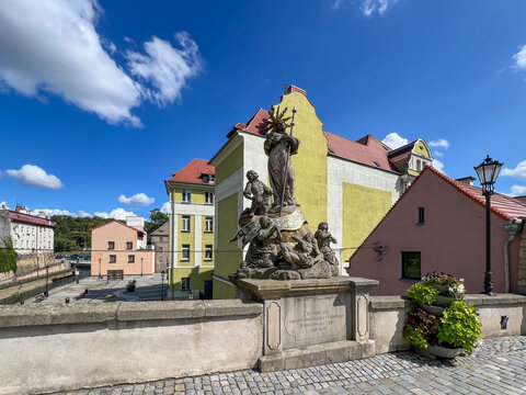 St. John's Bridge in Klodzko, Poland. Statue of St. John of Nepomuk on the bridge. Mlynowka River.