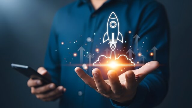 Businessman holding a rocket launching from his hand symbolizing innovation