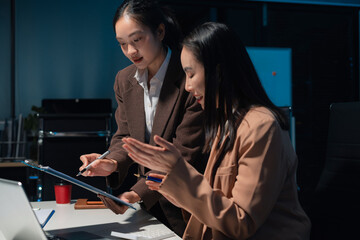 Diverse professionals collaborate on project analysis with financial graphs. Strategic teamwork and insights drive company growth and success.