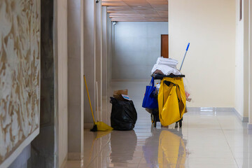 A hotel cleaning cart with supplies © skynex