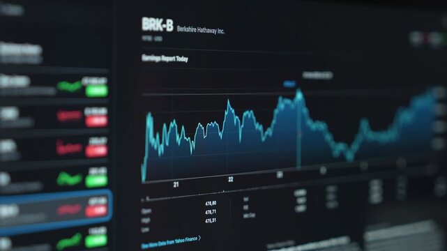 close up smartphone with laptop and open stock exchange, trading Online app interface. Man hand scrolling touch screen analysing chart forex crypto currency.