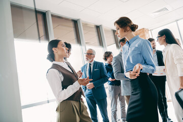 Professional team in a modern office collaborating during a corporate meeting showcasing teamwork and business discussions