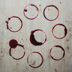 Valenstine day Red wine glass rings on wooden table with spills and stains