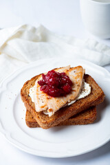 Open Sandwich with leftover turkey slices with cranberry sauce on top. Perfect holiday breakfast or lunch