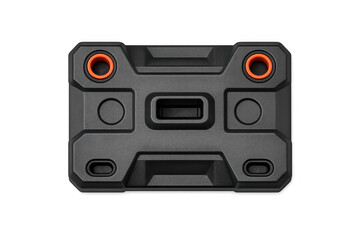 Fototapeta premium Rugged black device with orange accents and central port, isolated on black background