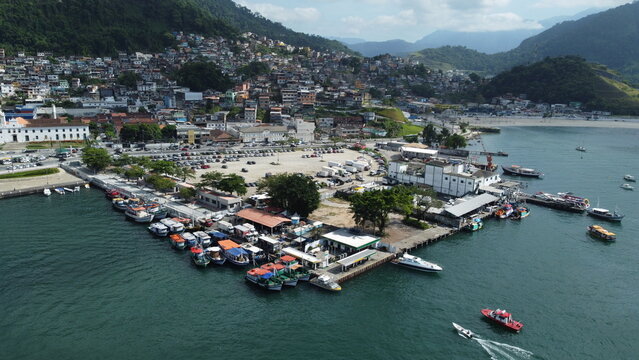 Angra Dos Reis, Brazil, January 13, 2025: Aerial drone photograph of colorful fishing boats moored at a pier in Angra dos Reis, Brazil