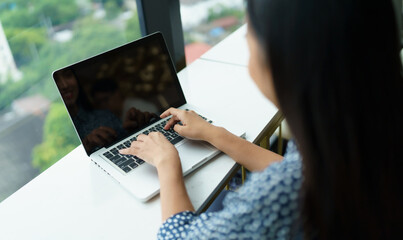 Asian woman digital nomad freelancer work typing laptop on online meeting Remote work 