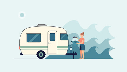 Fototapeta premium Woman Refilling Water Tank On Camping Trailer For A Relaxing Road Trip