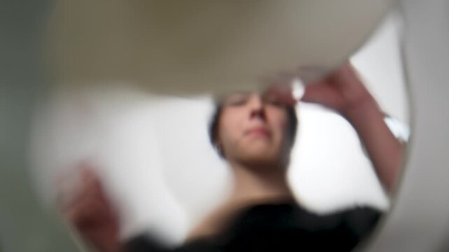 Point of view shot from inside a toilet showing a teenager discarding a small plastic bag with white powder. Concept of drug disposal, prevention, addiction, and illegal substances. Stop narcotics