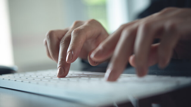 Closeup, business woman hand typing on desktop computer keyboard, online working, searching the information, surfing the internet on office table, remote work, online job, business background