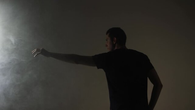 A rock vocalist in the midst of a destructive emotional outburst, screaming directly at the lens. Motion blur captures his unstable, frenzied state.