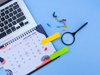 calendar 2026 event planner timetable agenda plan on calendar schedule event. Business meeting planning checking planner, taking note on calendar desk on office table. Calendar event work planer 2026 © Photix Studio