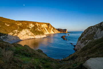Durdle Door sea arch at sunset Dorset England