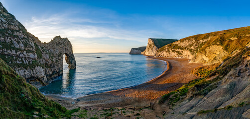 Durdle Door sea arch at sunset Dorset England