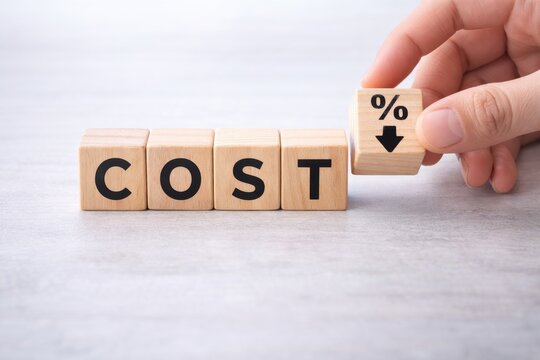 Hand placing percentage down arrow block next to cost, reduction concept