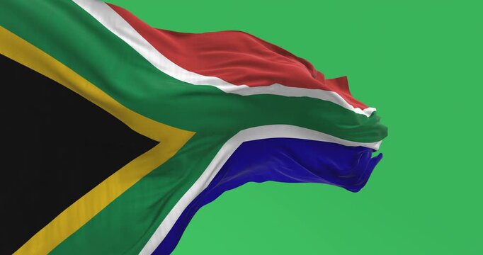 Detail of the South Africa flag waving isolated on green background