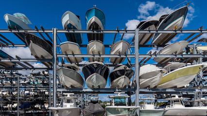 Row of boats sticking out of a boat storage rack in a marina. Maritime storage boat yard