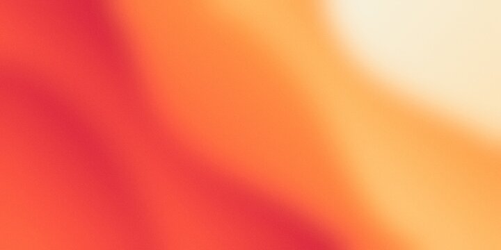 Abstract orange and red grainy gradient background with soft light leak