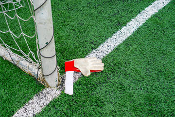 goalkeeper glove rest on the corner of the goal at horizontal composition