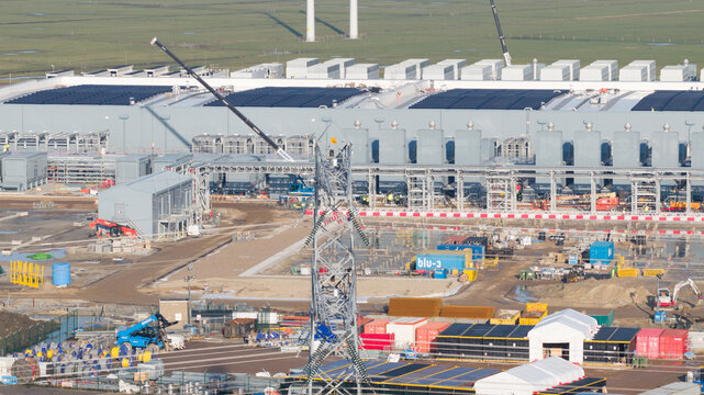Groningen, Netherlands - 20 January 2026: Aerial view of the sprawling Google datacenter construction site, where cranes tower over the intricate network of structures.