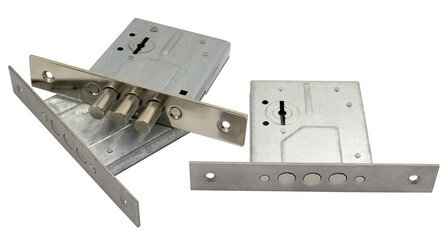 Three mechanical door locks on a white