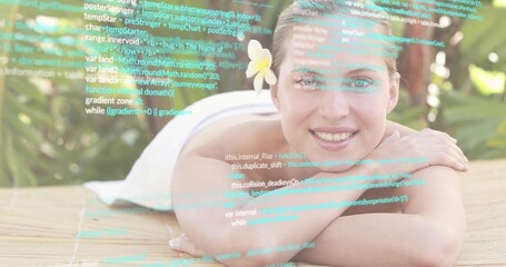 Lying woman resting on wooden mat in tropical garden, showing white towel, plumeria, code overlay