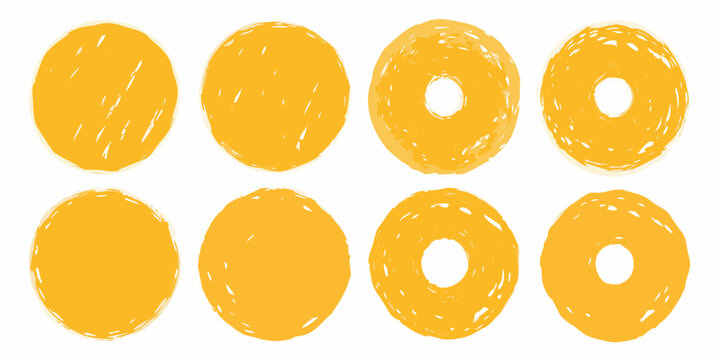A collection of hand drawn style yellow circles and ring shapes