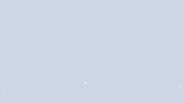 Falling Snow: Capture the delicate beauty and serene ambiance of falling snow against a pale blue backdrop, symbolizing purity and the winter season.