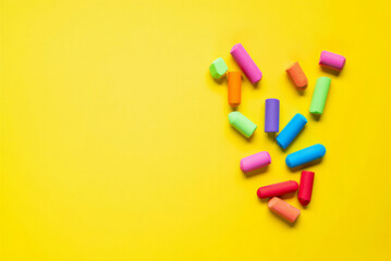 Colorful chalks on yellow background for drawing and art education in schools and creative activities for kids and adults  art supplies