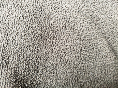 Fondo de textura de tela de forro polar gris con superficie suave