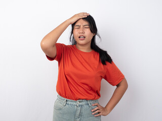 Portrait of young Asian woman isolated by white background feeling frustrated with helpless face expression. Irritated face expressions show negative attitude concept image