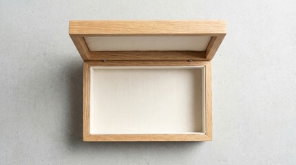 An open wooden shadow box with a light interior