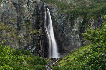 view of the picturesque Feigefossen Waterfall on the south side of the Lustrafjorden in central Norway