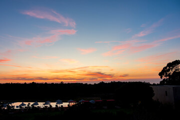 Obraz premium Great views of the sun setting at Praia do Canal in Portugal.