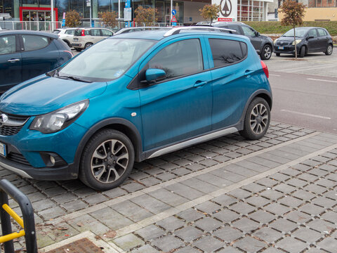 Blue Opel Karl Rocks hatchback parked in a busy urban supermarket parking lot next to Eurospar during the daytime
