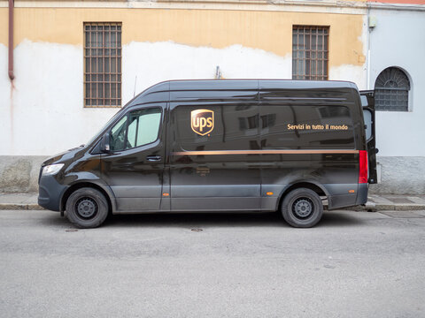 UPS Mercedes Benz Sprinter delivery van parked on street, offering global package shipping services