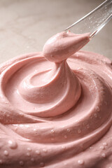 Macro Close Up of Pink Clay Face Mask Texture with Glass Spatula for Skincare Beauty Advertising