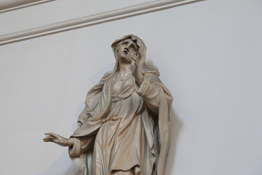 Statue of a Woman Detail at the Mozes en A&auml;ronkerk Church in Amsterdam, Netherlands