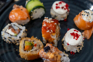Gourmet seafood plate with maki sushi variation