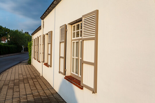 Facade of an old white house with shutters in Knokke, West Flanders, Belgium, Europe