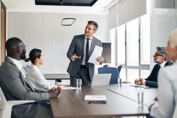 Businessman presenting information during corporate business meeting