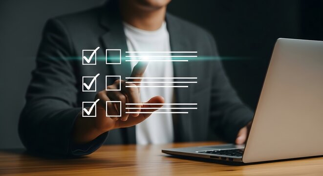Man using laptop for online survey form with checklist and checkboxes for task management system