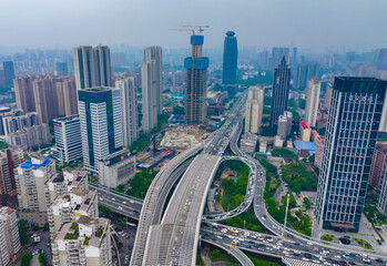 Obraz premium Aerial View of Wuhan City with Elevated Highway Interchange and Modern Skyline